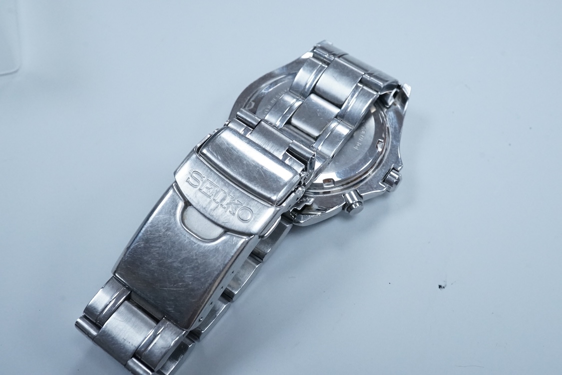 A gentleman's 1970's stainless steel Omega Dynamic manual wind wrist watch, with blue dial and baton numerals, case diameter 40mm, on a leather strap wit Omega buckle, together with a gentleman's Seiko Kinetic and a simi